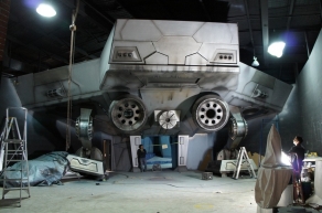 Installation shot of crew members working on the installation of Starro's spaceship at Warner Bros. Movie World Australia